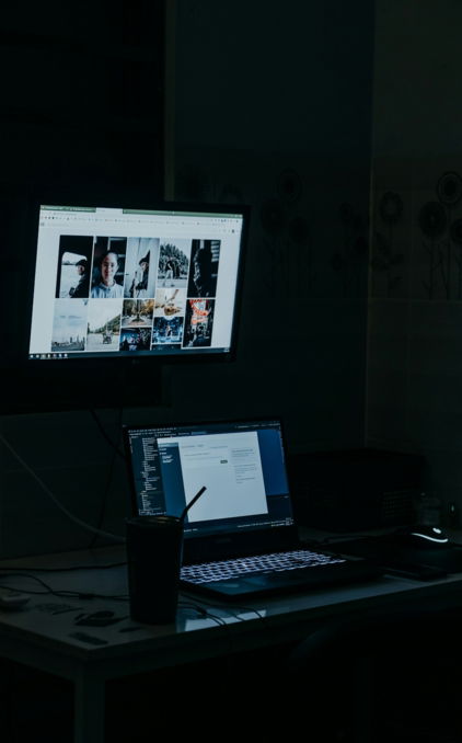 a laptop computer sitting on top of a desk